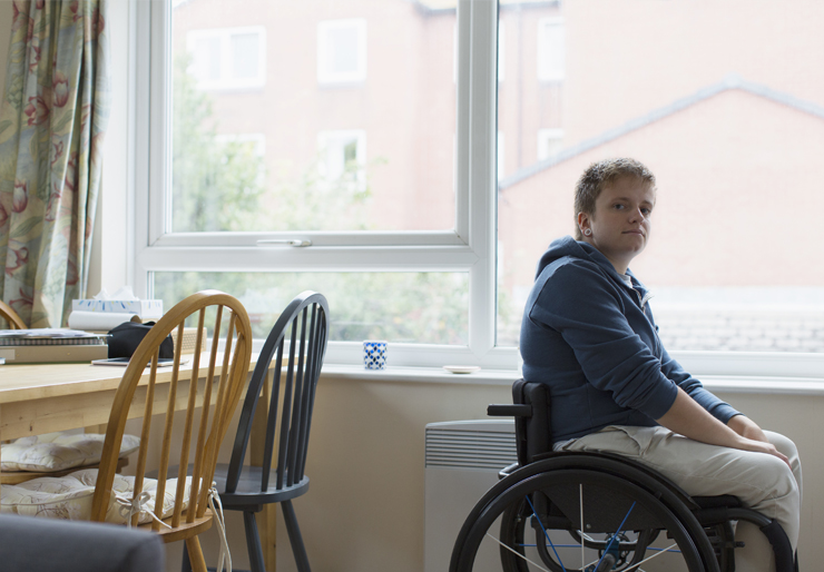 Young person in wheelchair at home